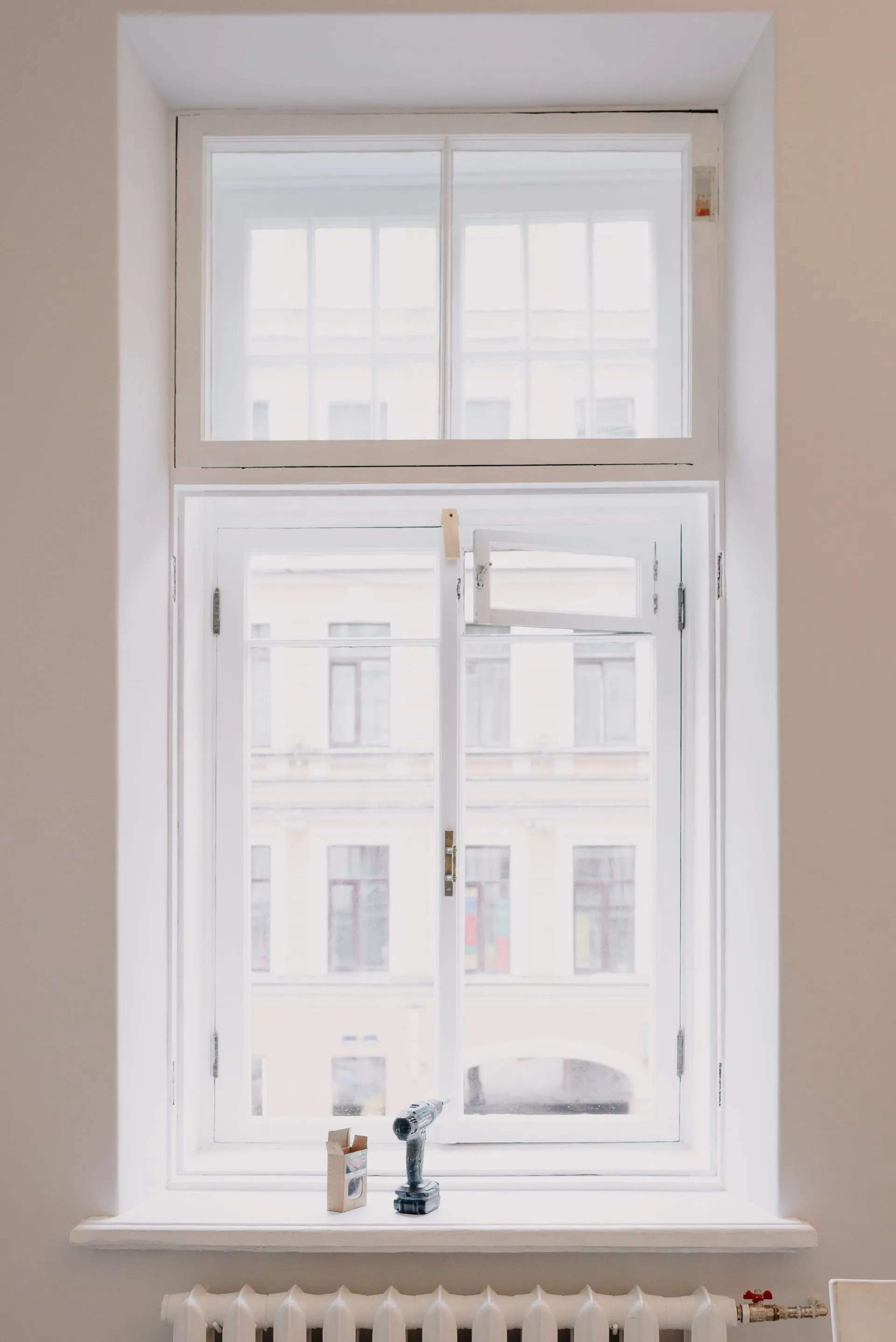 Newly fitted window letting daylight into a room while blocking heat